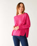 woman wearing mersea banff cashmere sweater in hot magenta