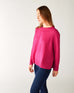 profile of woman wearing mersea banff cashmere sweater in hot magenta