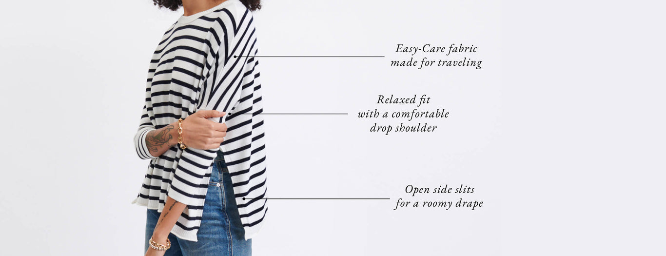 Female wearing a navy and white striped tee. Features details: easy care, relaxed fit and open side slits.