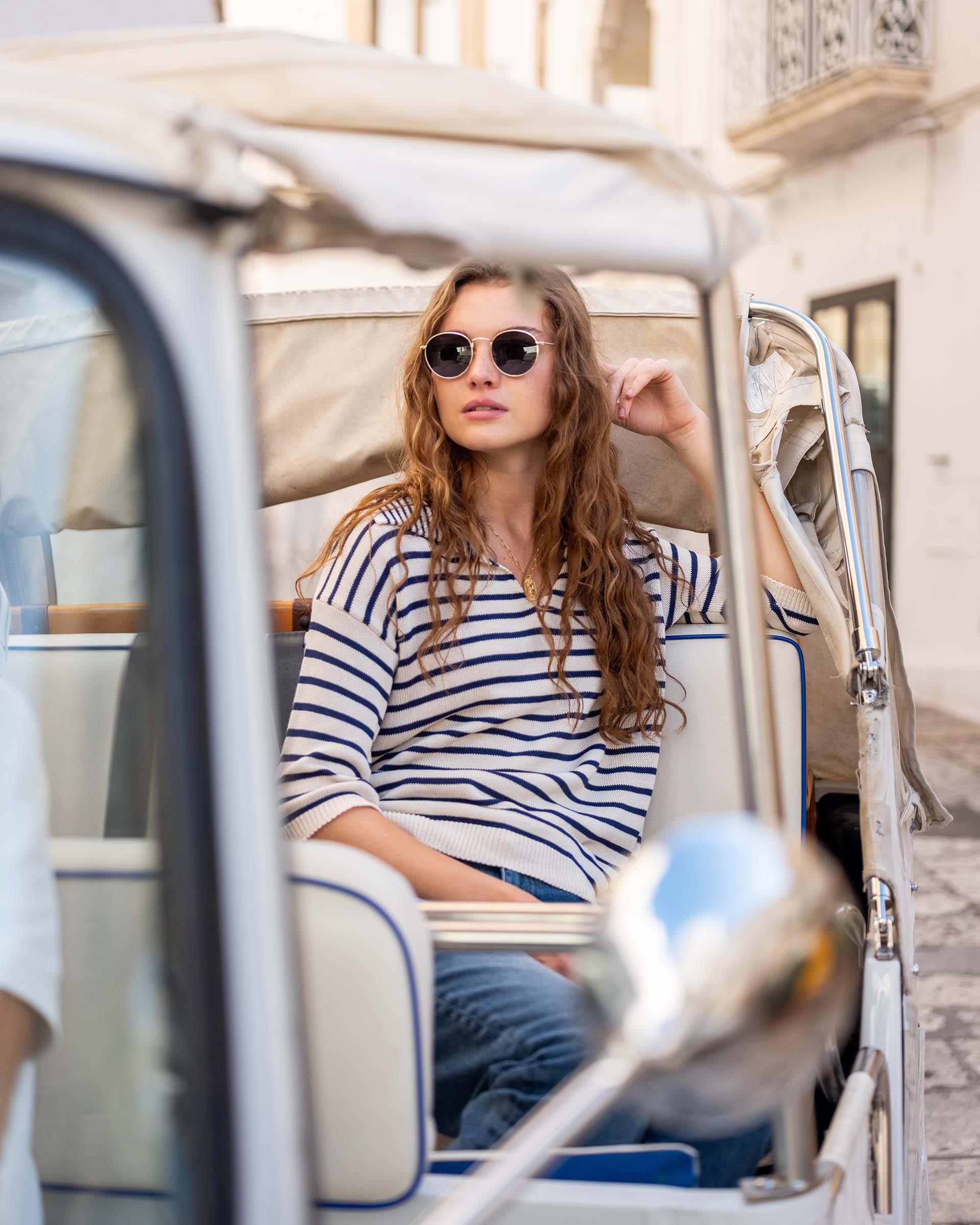 Women's White Navy Striped Relaxed Fit Split Collar V-neck Breton Polo Sweater Travel Destination Look Sitting