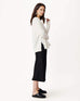 profile of woman wearing mersea banff cashmere sweater in winter white