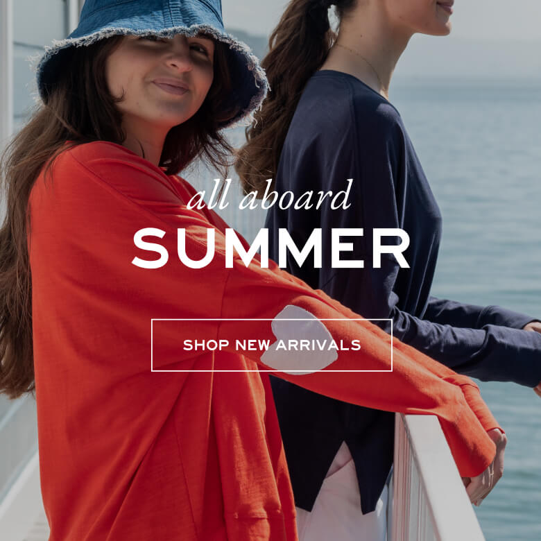 all aboard summer - shop new arrivals - two women wearing long sleeve tees with hearts on the elbow by the sea