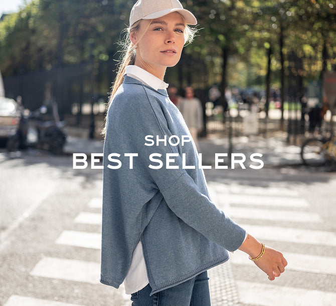 Woman walking outdoors with 'Shop Best Sellers' text overlay