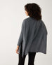 rearview of female wearing mersea storm catalina sweater standing against a white background