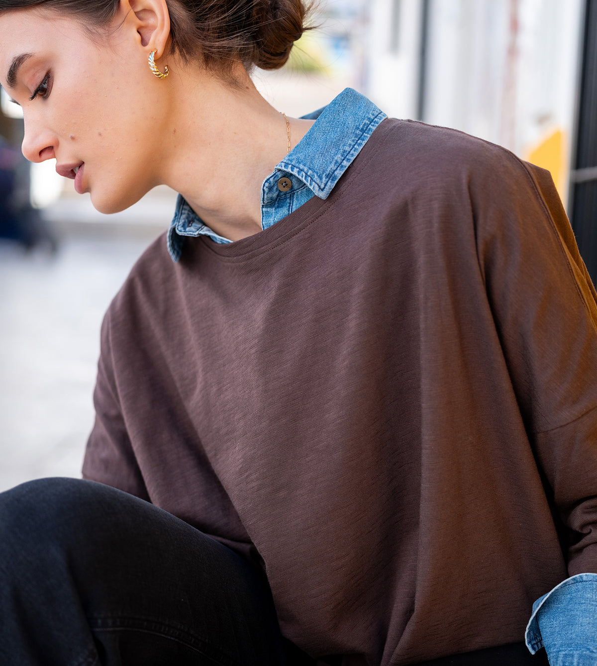 Dark cocoa brown crewneck tee with a relaxed fit and soft knit fabric.