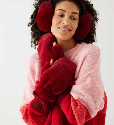 female wearing red faux fur scarf with matching gloves and earmuffs on a white background