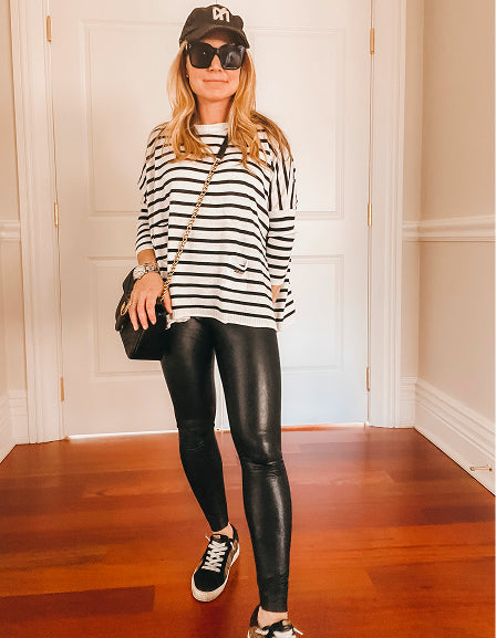 MERSEA ladies' travel-ready horizontal stripe knit top in black and white with a crew neck.