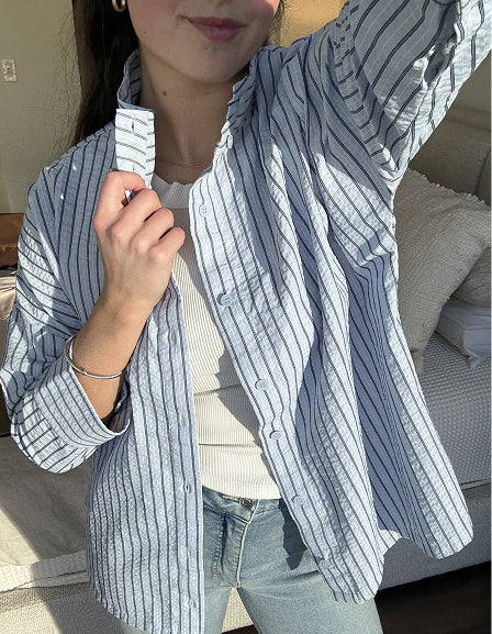 MERSEA women's travel-friendly blue and white striped button-front relaxed fit cotton shirt with rolled sleeves.