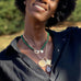 woman wearing mersea colab sagittarius zodiac pendant with chain