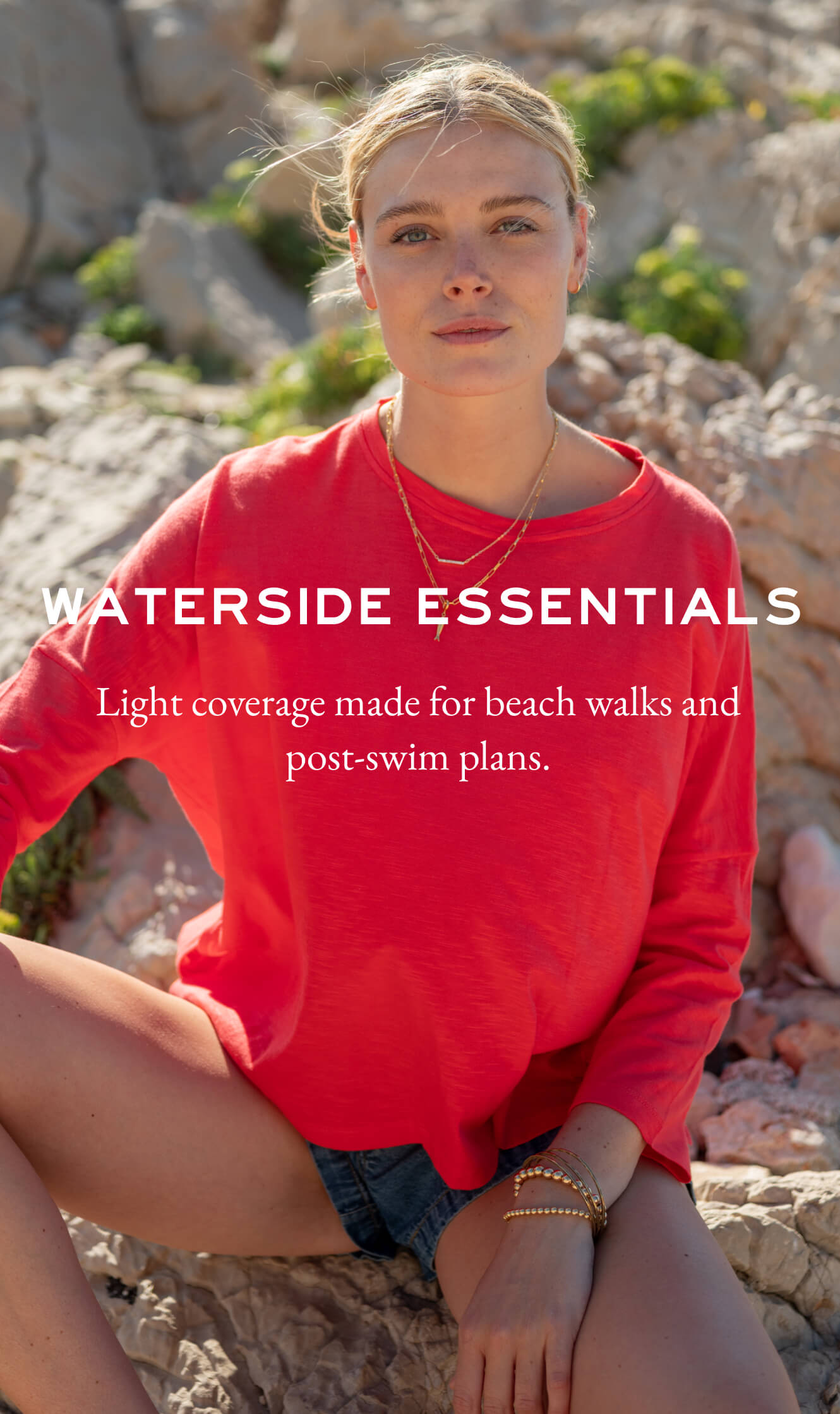 Woman in a red shirt sitting on rocks with promotional text overlay.
