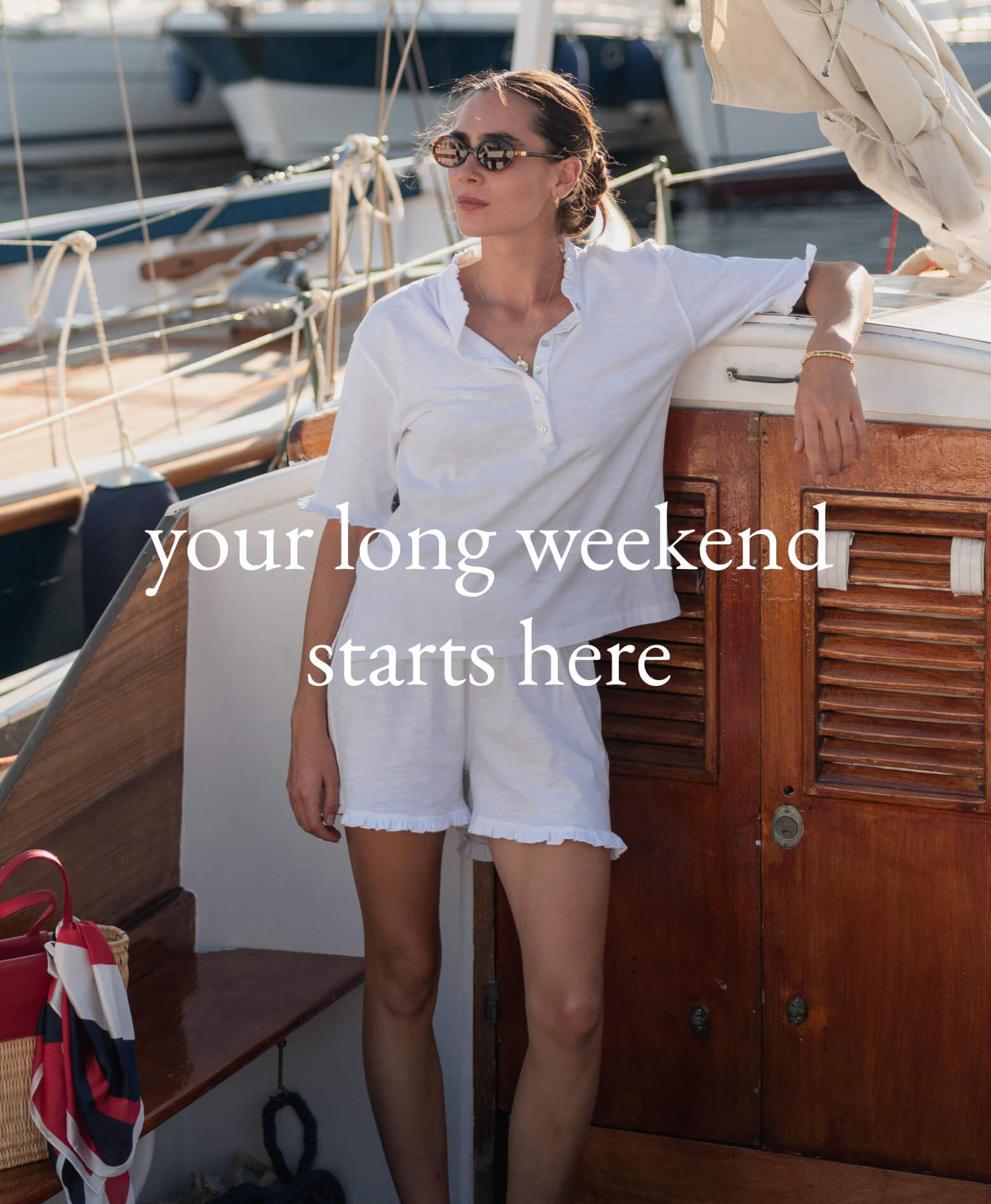 Woman on a boat with text 'your long weekend starts here'