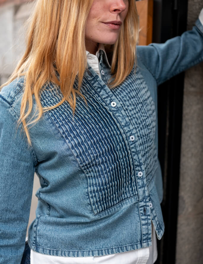 Blue denim-look button-down shirt with a unique gathered pleated textured front panel.