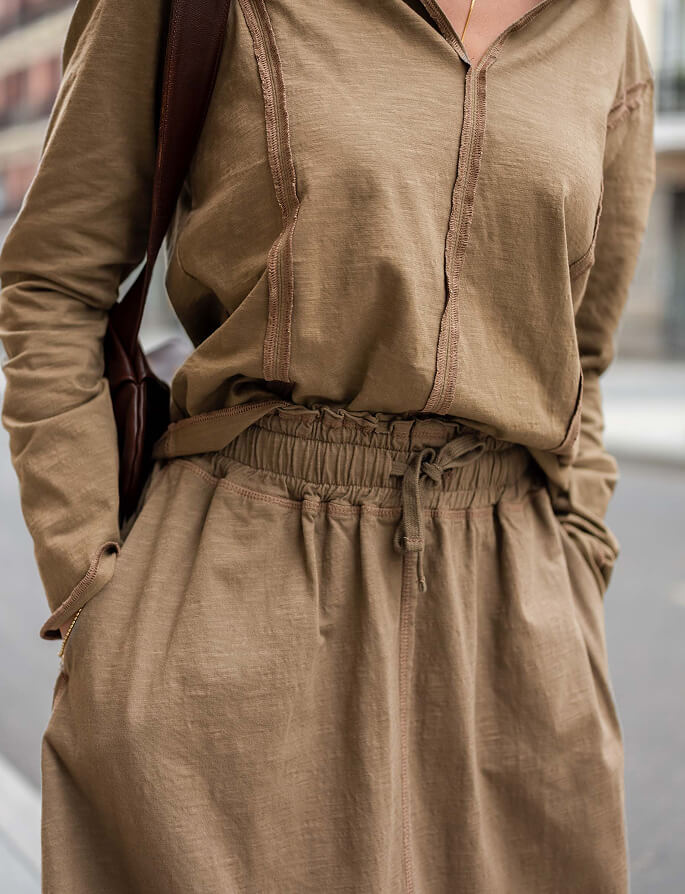Khaki linen-blend tunic and matching wide-leg trousers with gathered waist and drawstring detail.