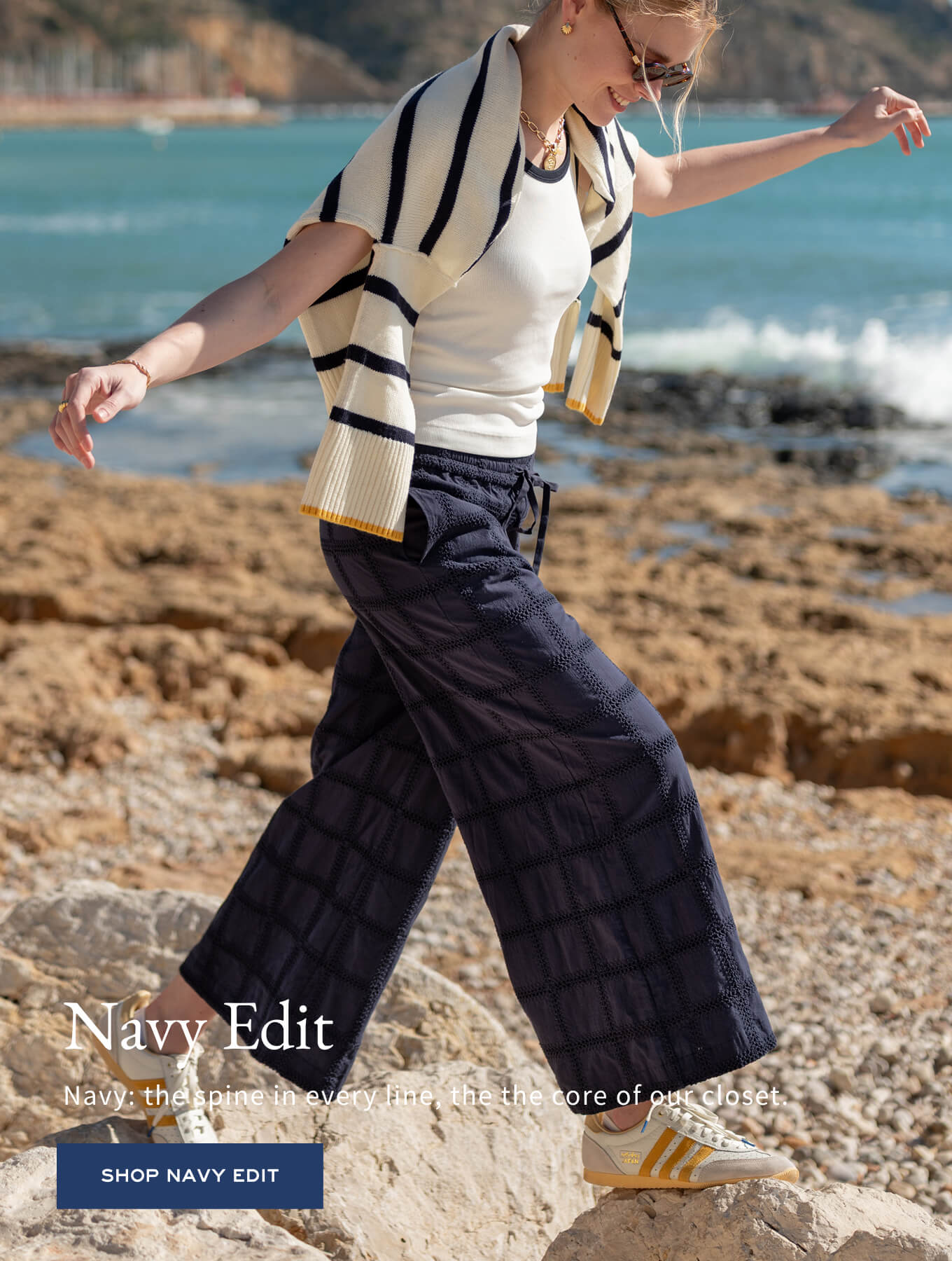 MERSEA navy blue paneled wide-leg trousers and a white t-shirt with a striped wrap.