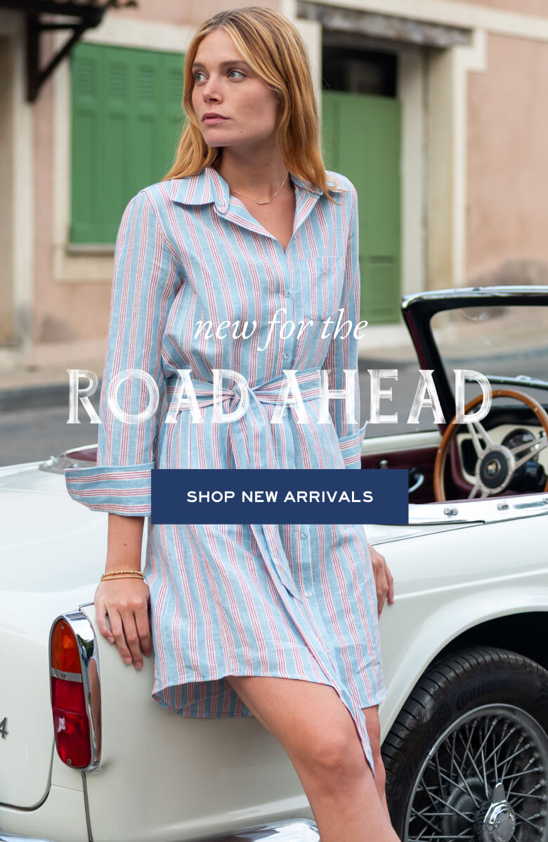 New for the Road Ahead - Shop New Arrivals - Image of a woman wearing a red and blue striped dress leaning against a car