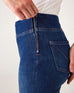 closeup view of side zipper on Woman showcasing Mersea Nomad cadet blue denim full length boot-cut jeans