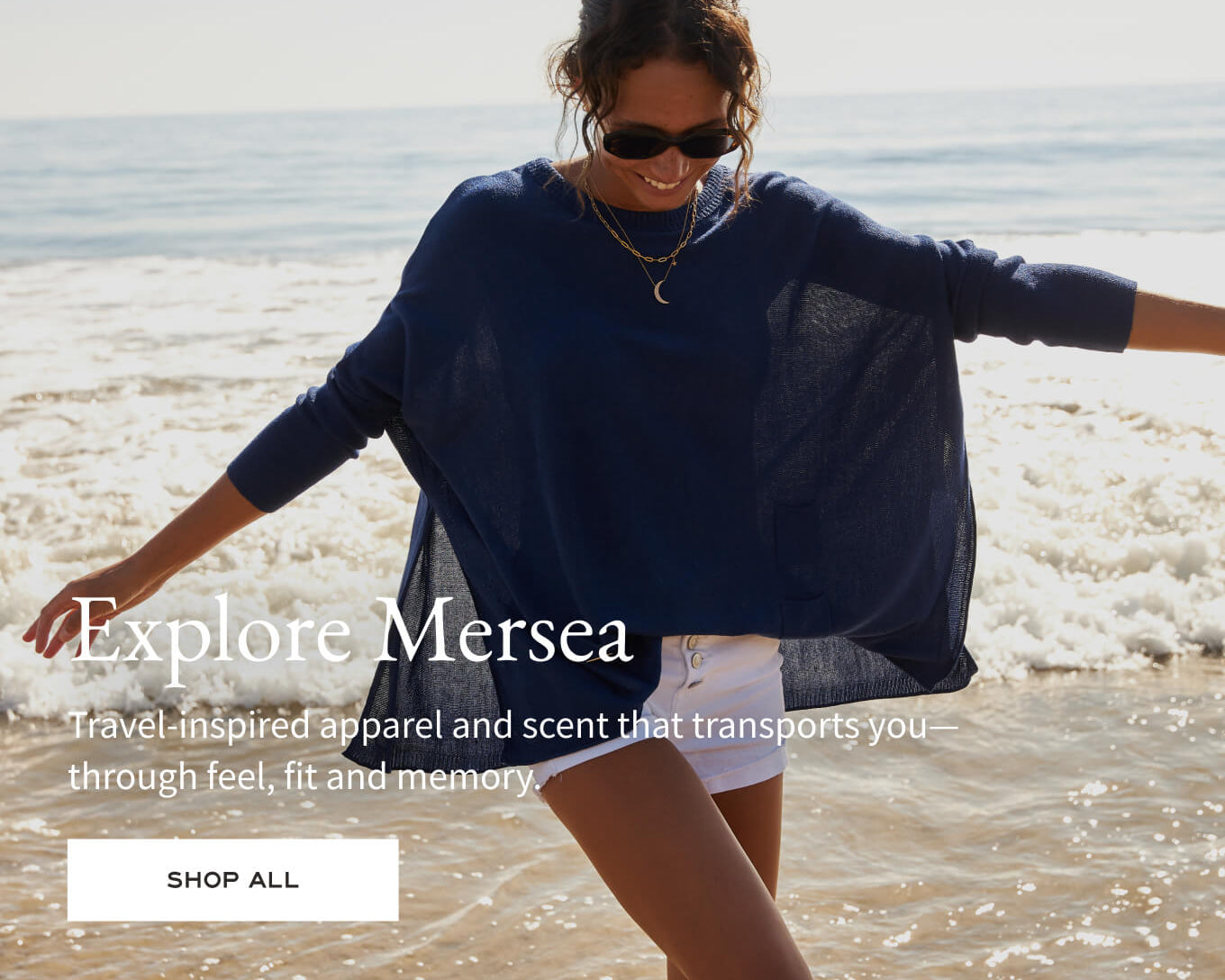 Woman on a beach with text overlay promoting 'Explore Mersea' brand.