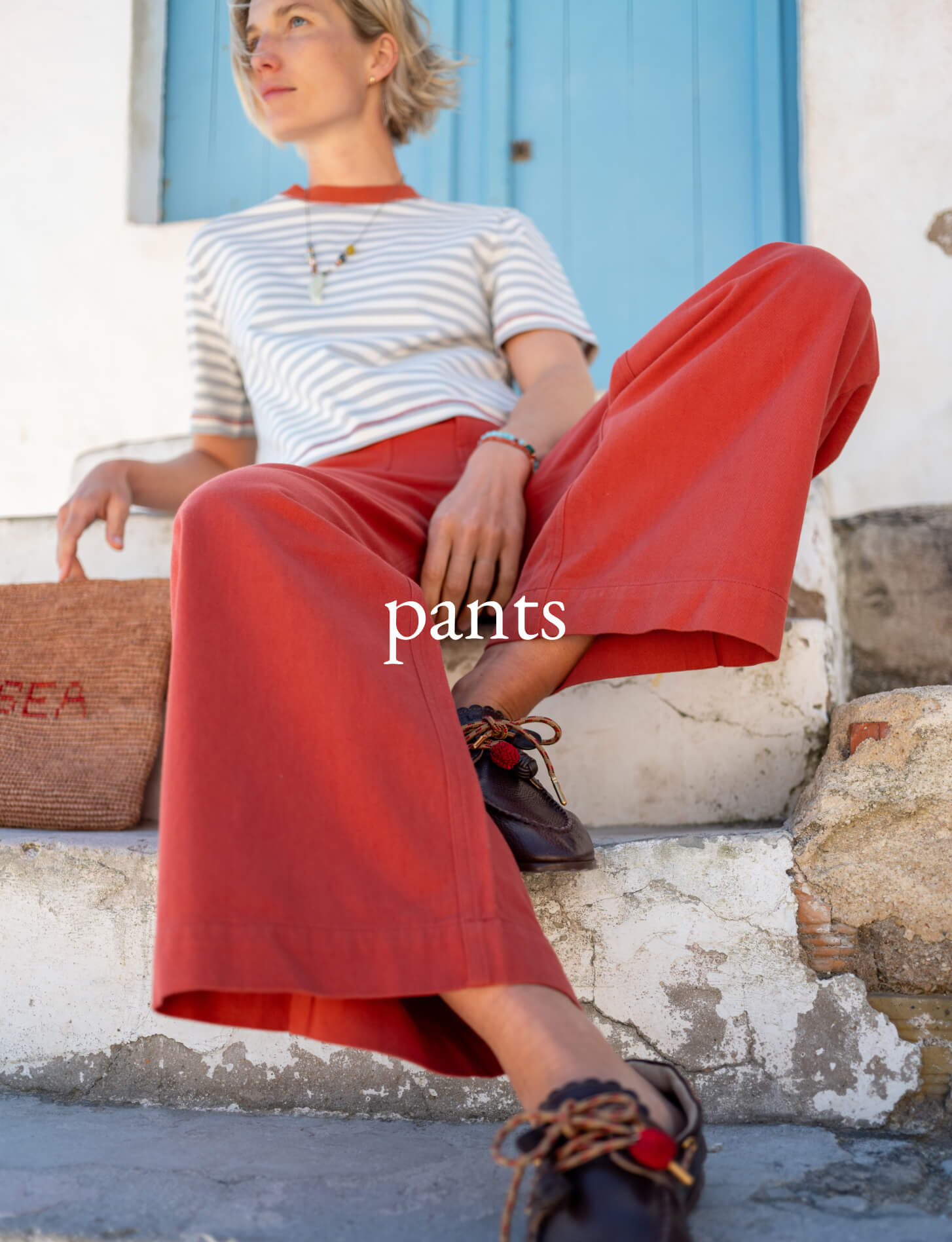 Terracotta wide-leg trousers in a breathable fabric. Text: SEA
pants