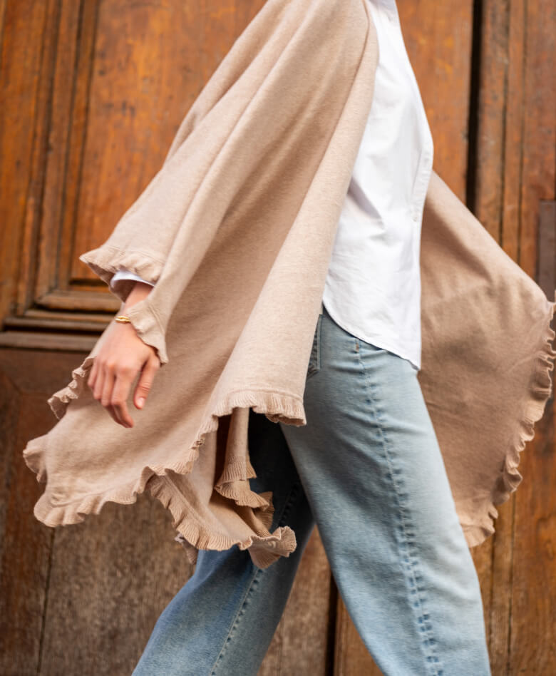 Close up image of a an travel wrap with ruffle detail