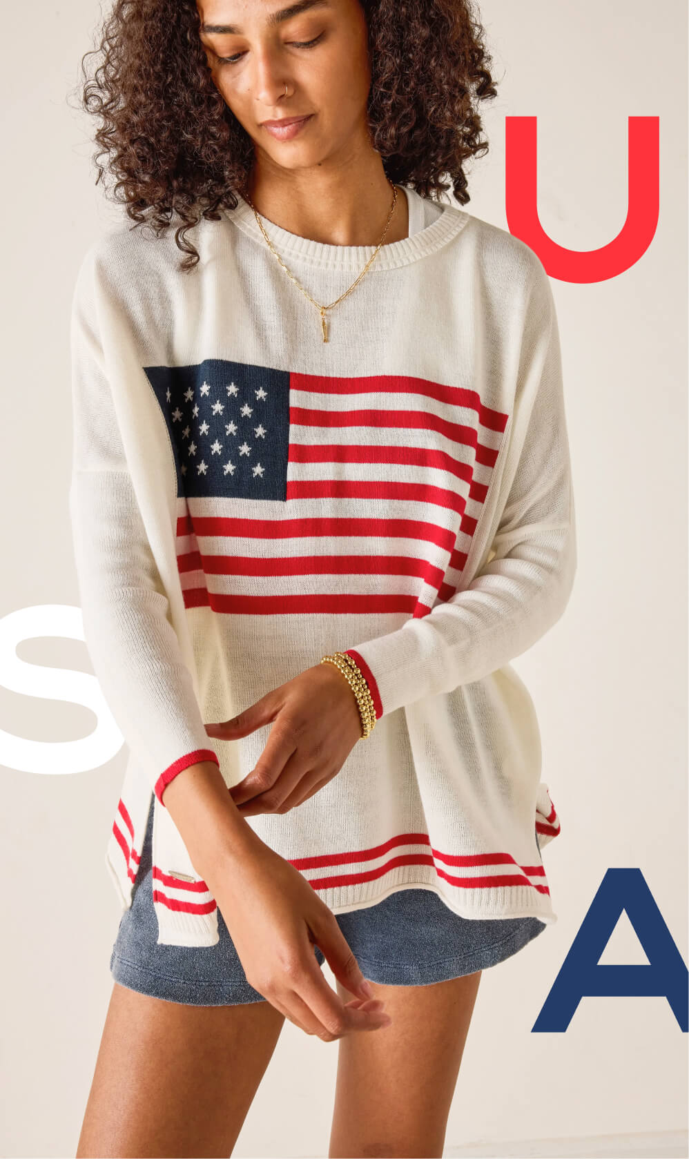 Image of a woman wearing an American flag sweater