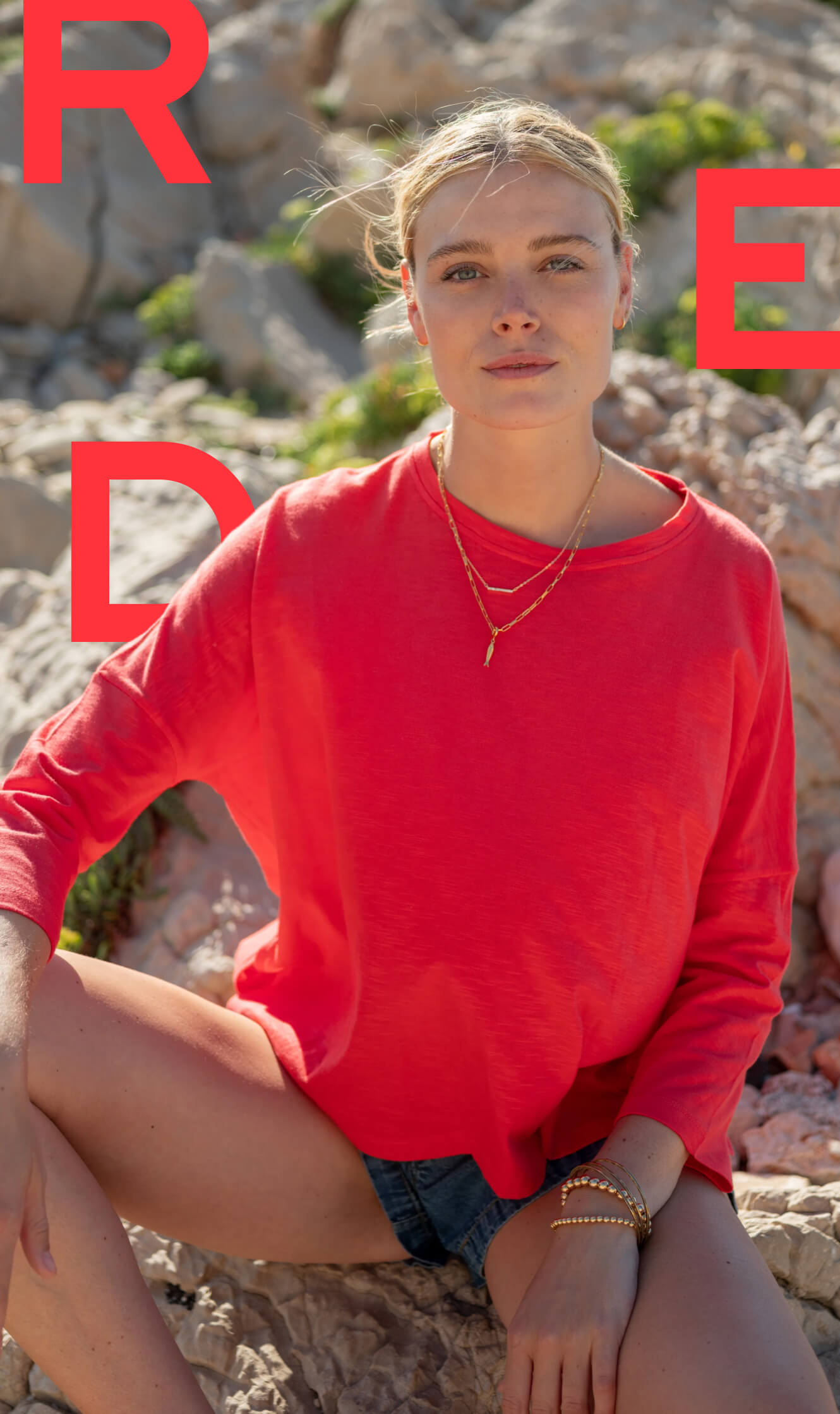 Image of a woman wearing a red ling sleeve tee