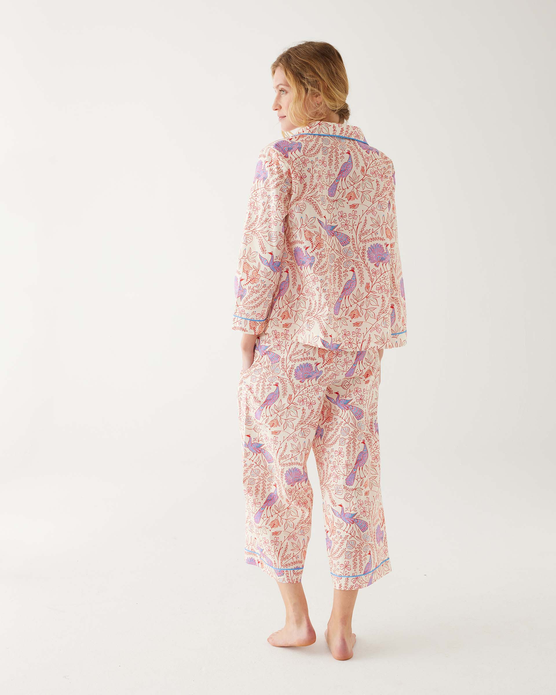 rearview of woman wearing mersea matching pajama set with peacock vines print