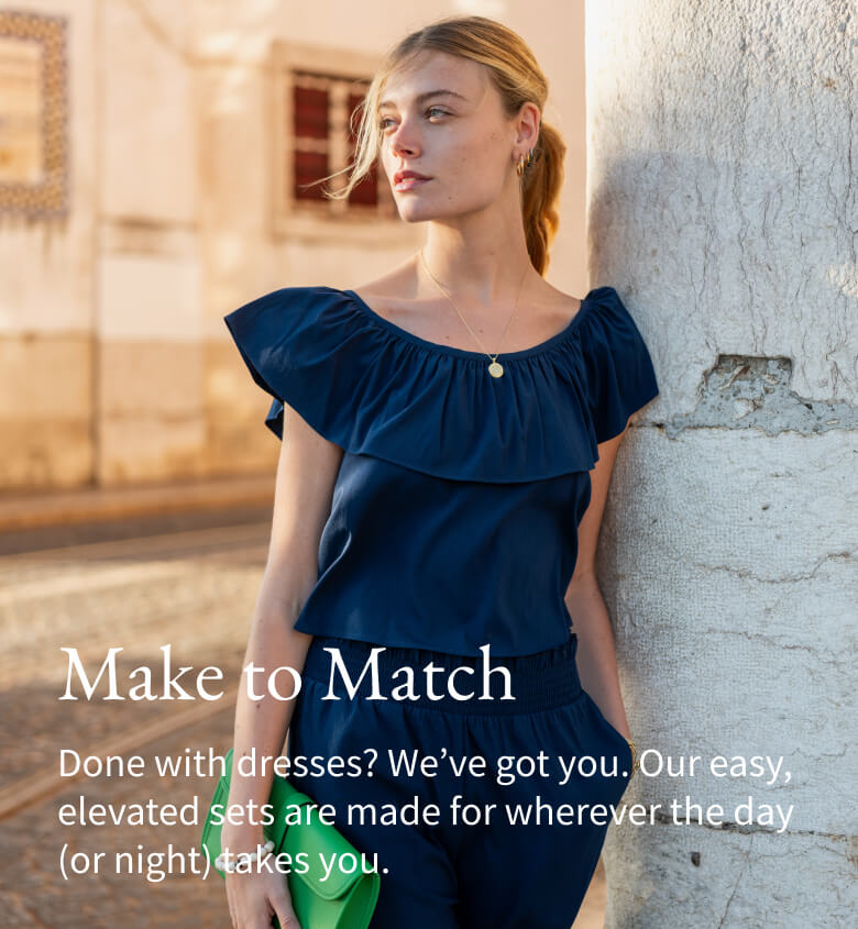 Make to Match - Done with dresses? We've got you. Our easy, elevated sets are made for wherever the day (or night) takes you. - Image of a woman wearing a navy ruffle top with matching navy pants