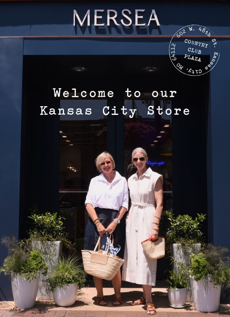 Two women standing in front of a store entrance with 'Mersea' branding and text 'Welcome to our Kansas City Store'.