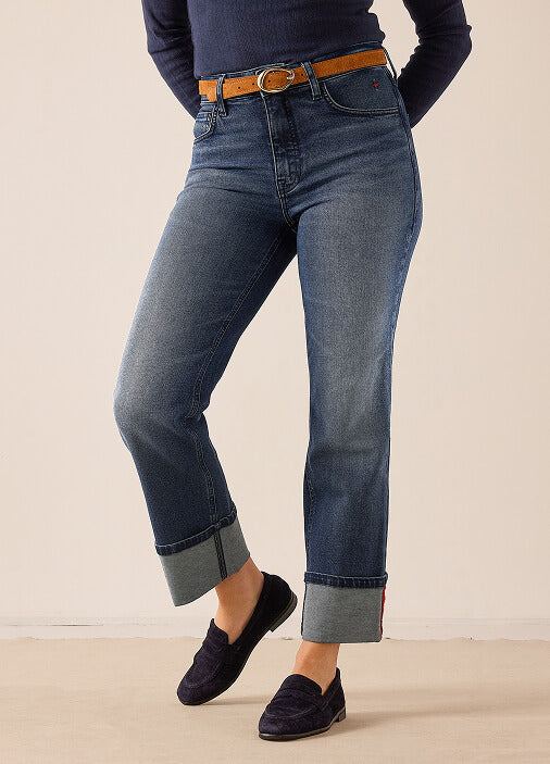 MERSEA women's travel-friendly blue straight-leg denim jeans with cuffed hems and a tan leather belt.