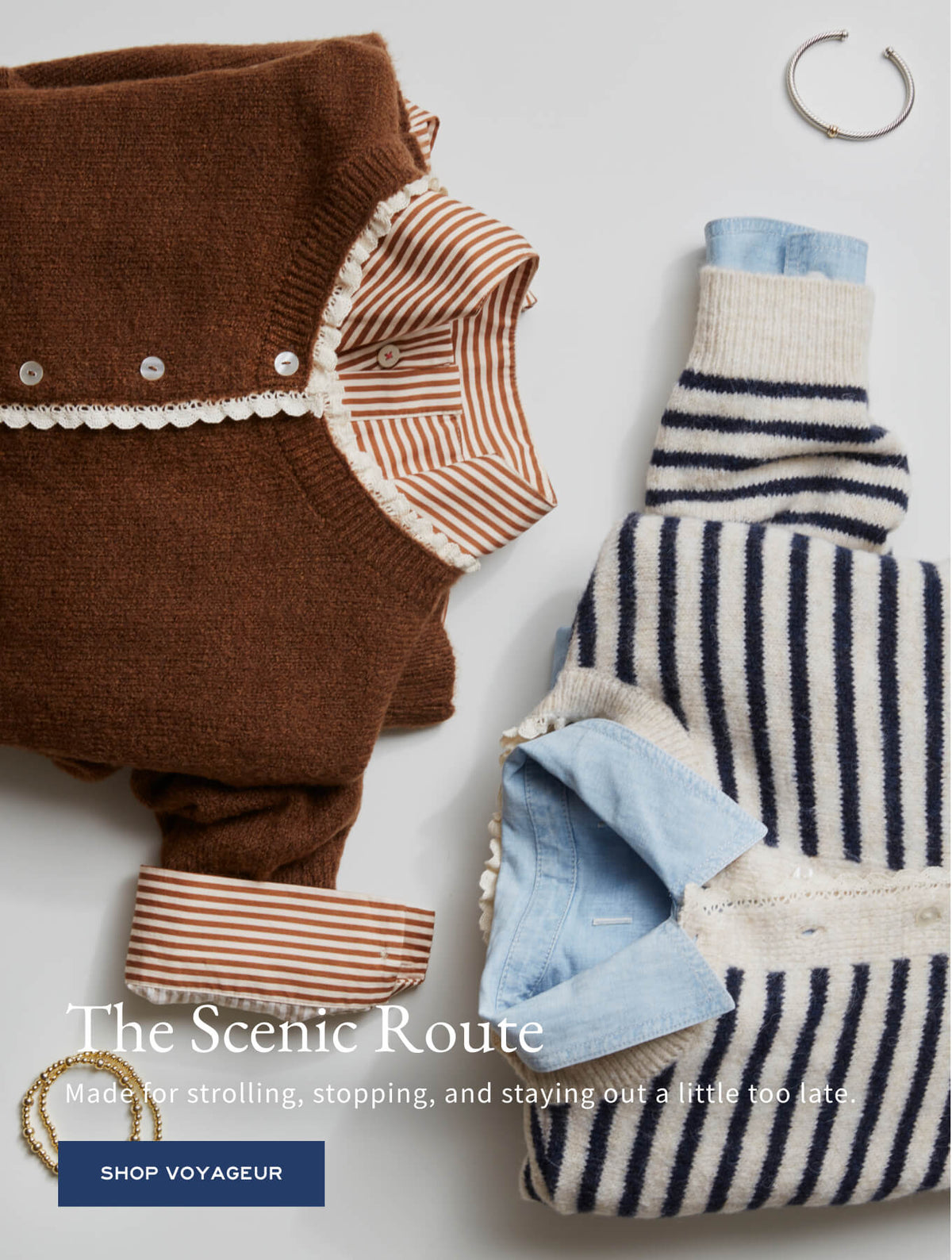 Promotional banner for the Voyegeur collection featuring a flat lay of two knit sweaters with decorative buttons and stripes. Text: 'The Scenic Route. Made for strolling, stopping, and staying out a little too late. SHOP VOYAGEUR'