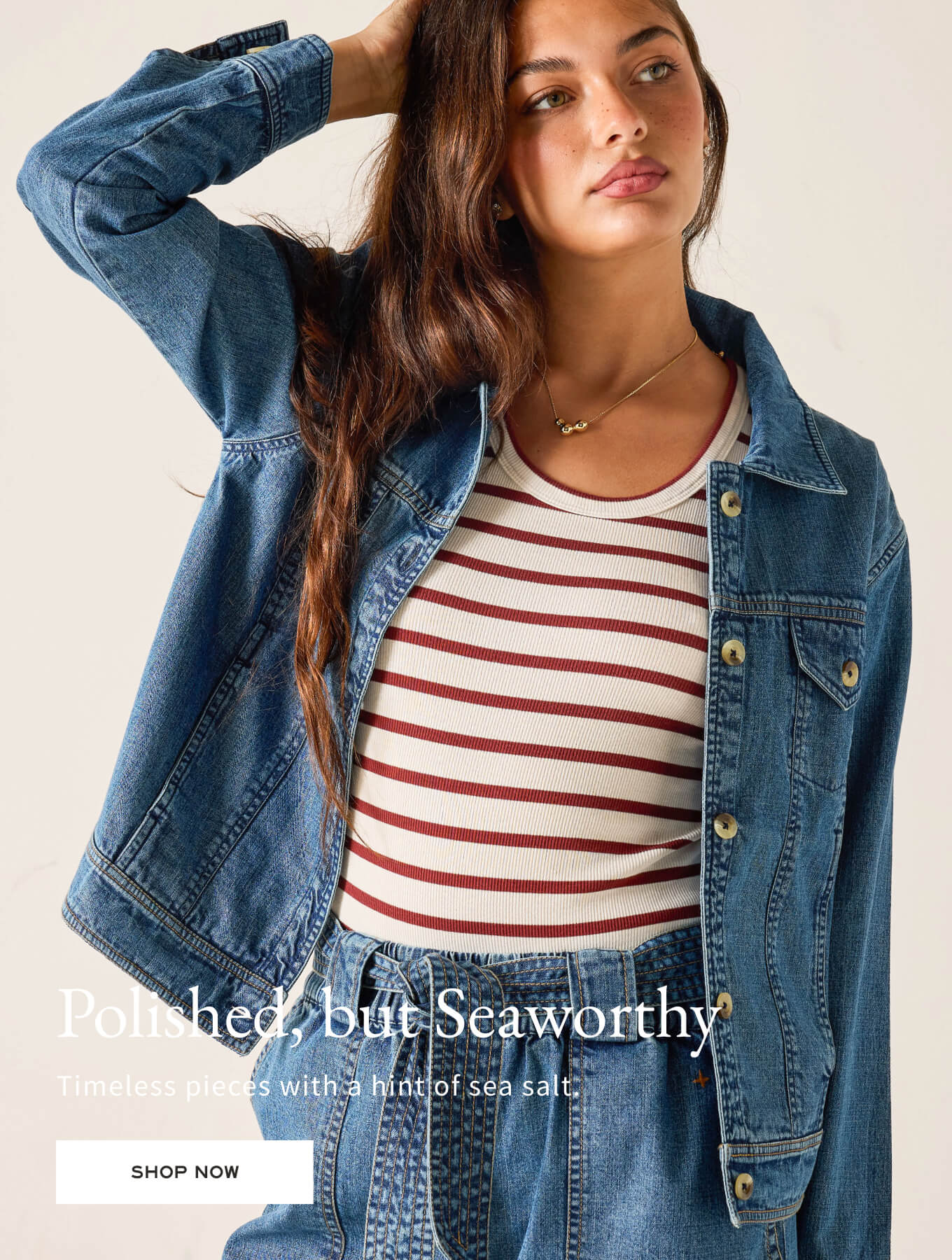 Woman wearing a denim jacket over a striped shirt with text overlay on a beige background