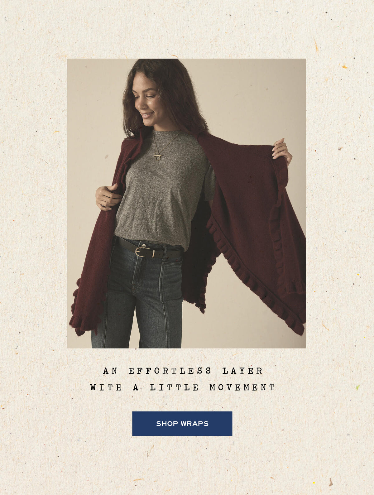 An effortless layer with a little movement - shop wraps - Image of a woman wearing a wrap with ruffle details.