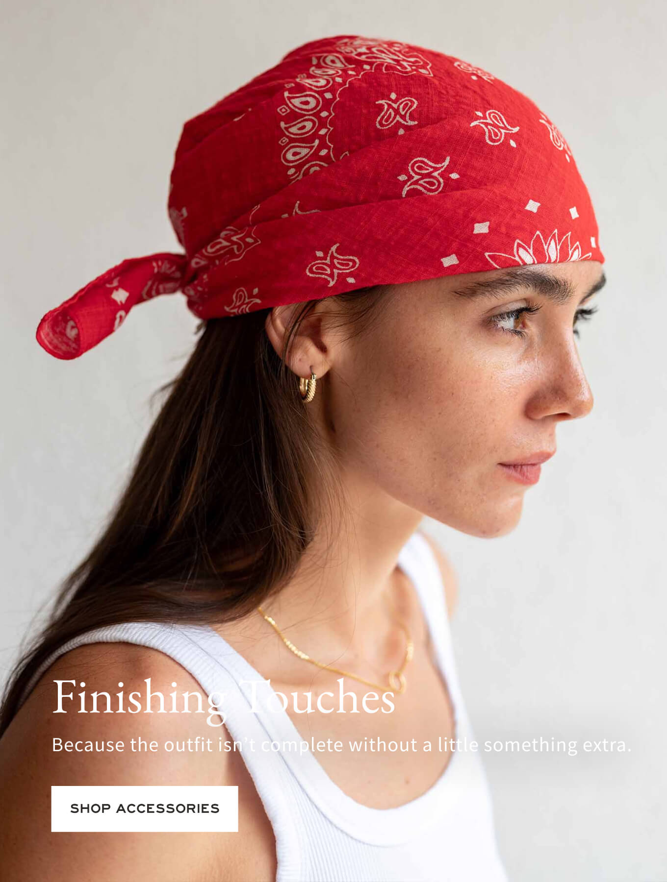 Woman wearing a red bandana with a plain background