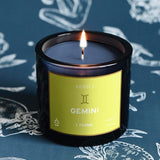 Mersea Gemini scented candle displayed on astrology sign-themed backdrop