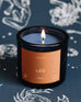 Mersea Leo candle against astrology sign background