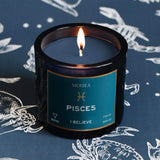 Mersea Pisces candle against astrology sign background