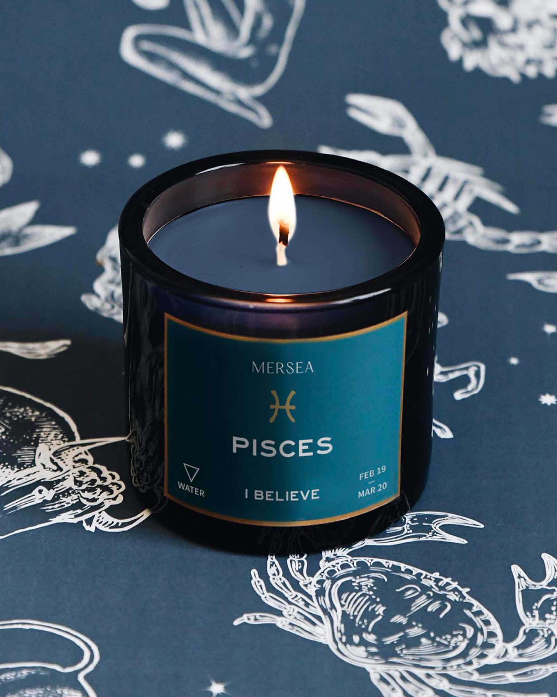 Mersea Pisces candle against astrology sign background