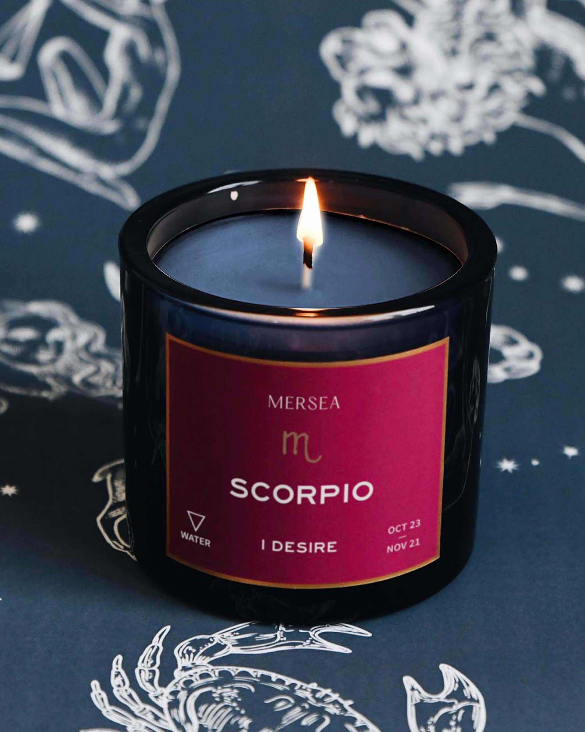 Mersea Scorpio candle against astrology sign background