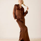 Chocolate brown silk button-up shirt and matching wide-leg pants set.