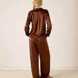 Chocolate brown button-up oversized shirt in silk-like fabric with back pleat detail.
