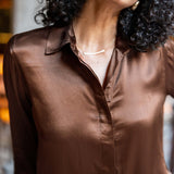Chocolate brown satin button-up shirt with a classic collar.