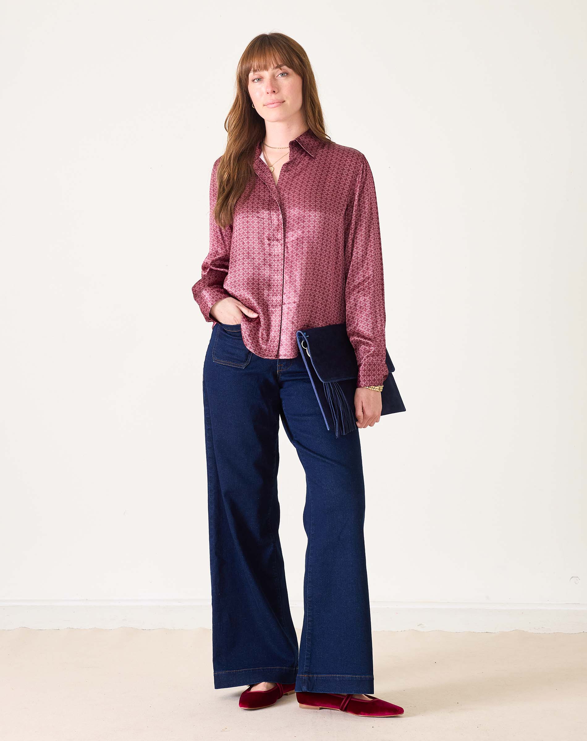 Women's travel-friendly mauve and gold button-up shirt in a textured fabric.