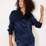 Navy blue silk-like button-up shirt with long sleeves.