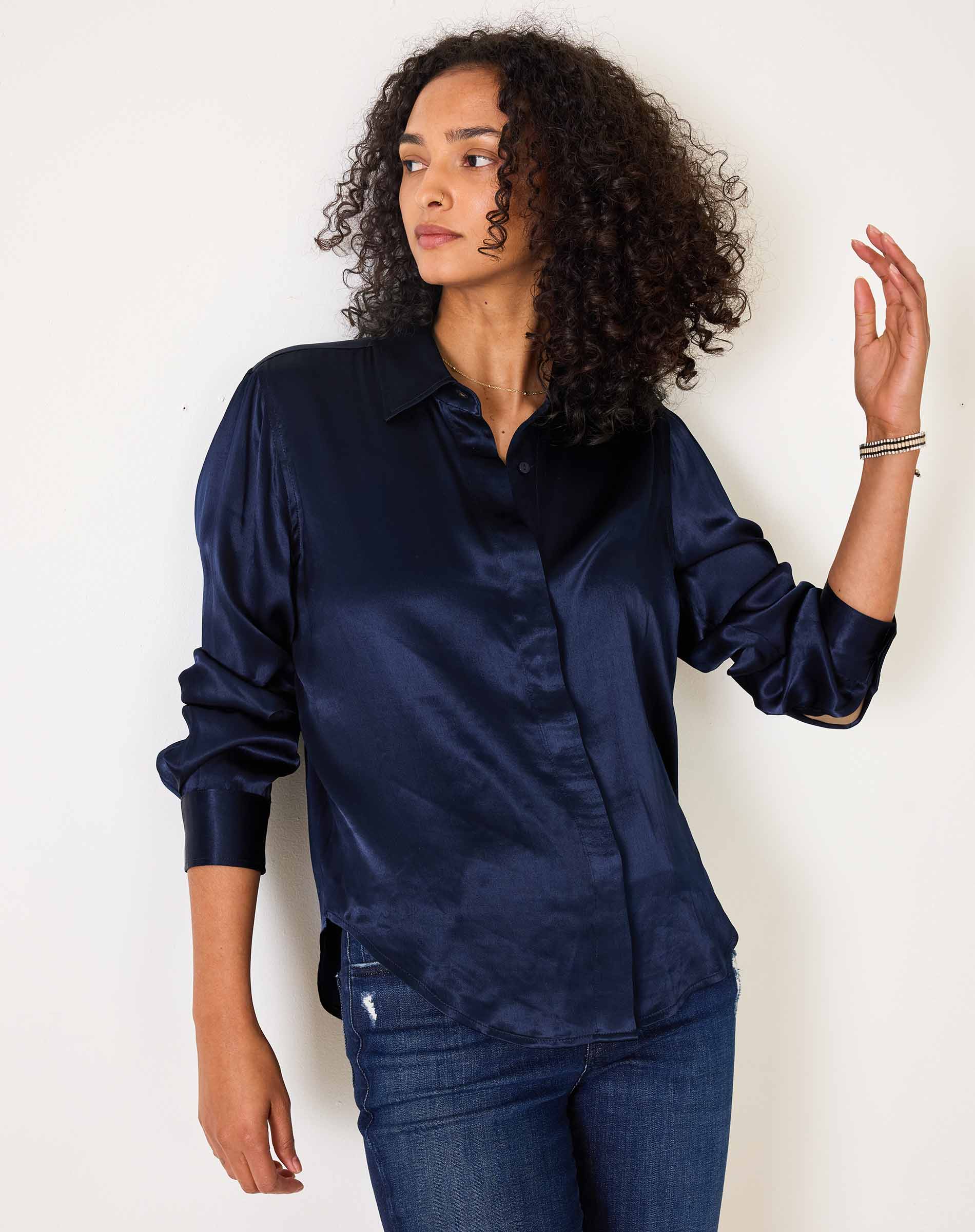 Navy blue silk-like button-up shirt with long sleeves.