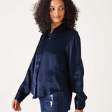Navy blue oversized button-up shirt in a smooth silk-like fabric.