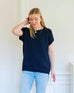 woman wearing navy short sleeve sweater full view