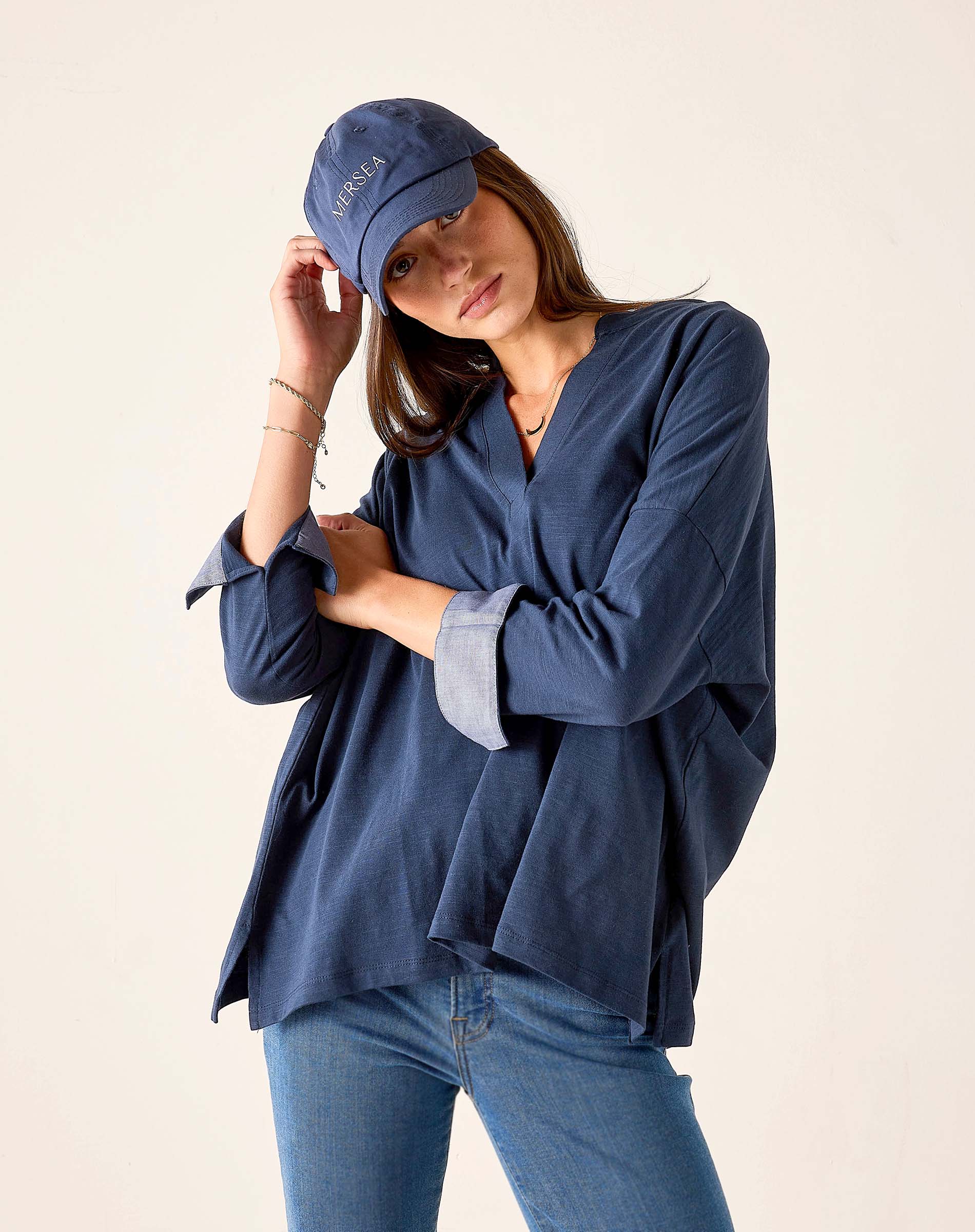 Navy chambray tee with rolled sleeves and relaxed fit.