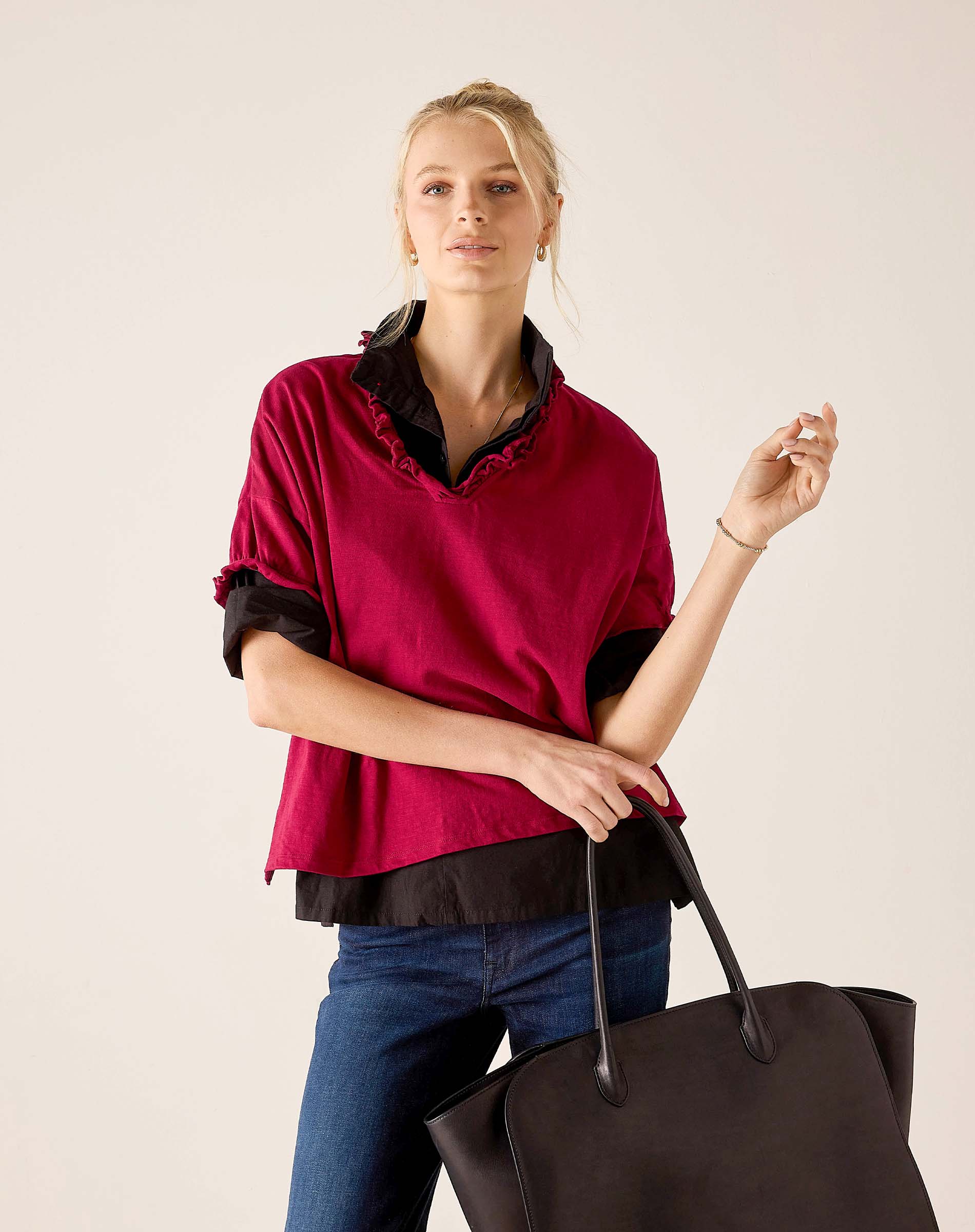 MERSEA women's travel-friendly berry and noir ruffled tee with a layered look over jeans.