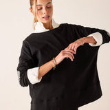 Black gingham appliqué tee featuring a layered shirt style with white collar and cuff details.