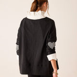 Back view of women's travel-friendly black and white gingham applique tee featuring a relaxed fit and layered ruffle detail.